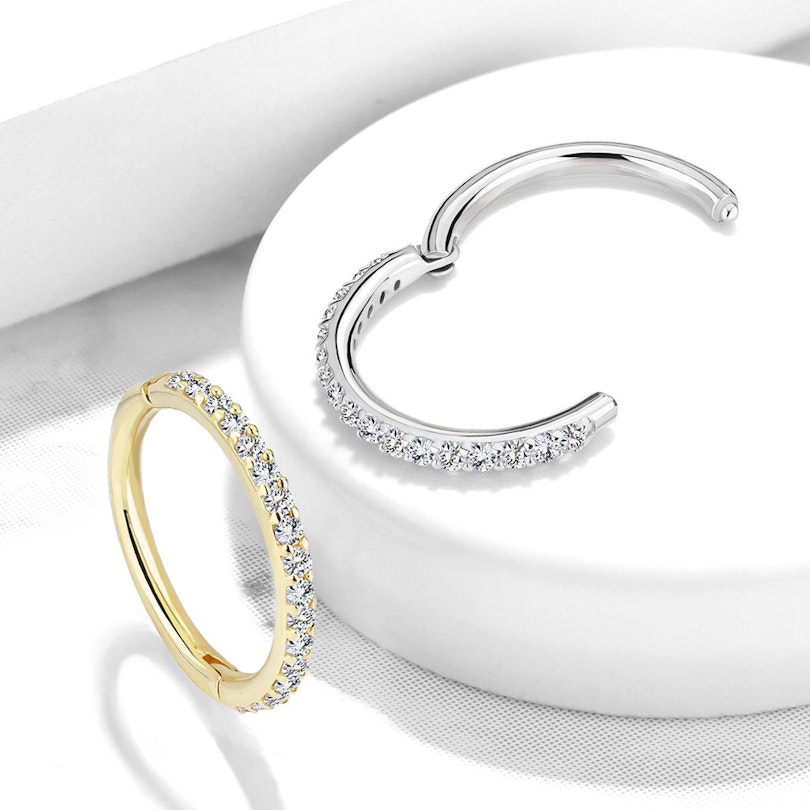 Hinged segment ring made of 14k gold with zirconia channel