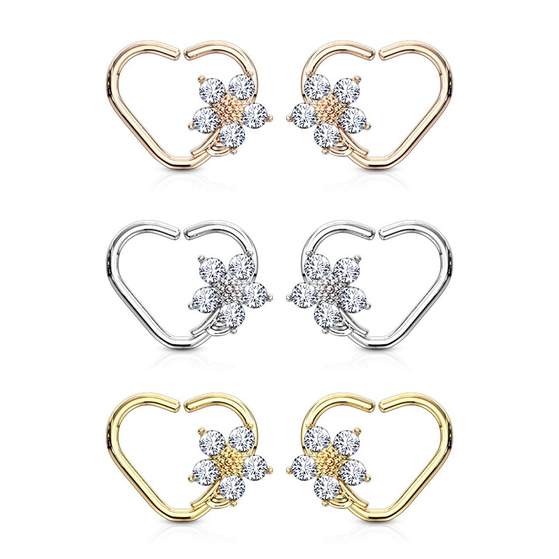 Ear piercing with heart shape and flower charm