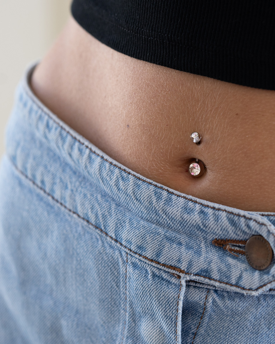 Fantastic belly button ring with acrylic balls with bezel set stones in different colors