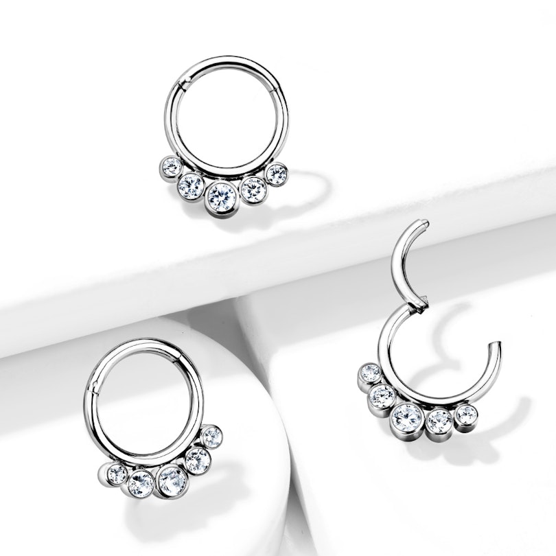 Hinged titanium ring with five gemstones