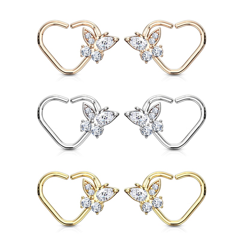 Ear piercing with heart shape and studded butterfly charm