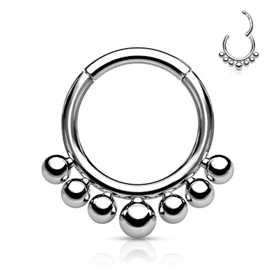 Ring made of titanium with a hinge and small beads
