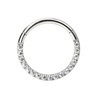 Hinged ring made of titanium with row of stones