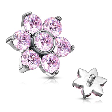 Dermal top jewelry with stones forming a flower.