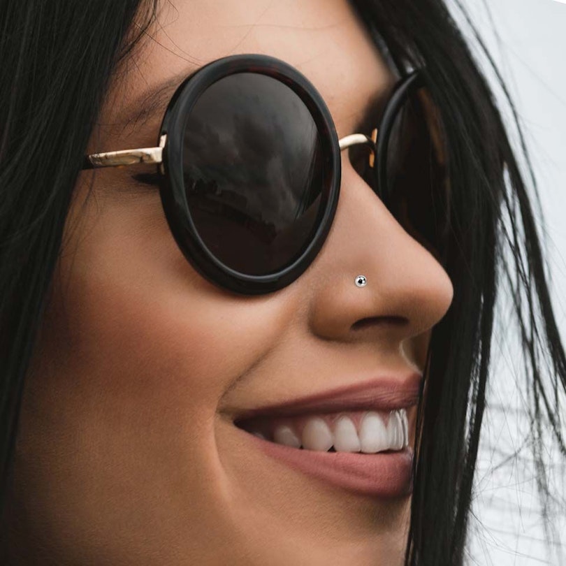 Nose ring made of 14k gold with ball Body Piercing