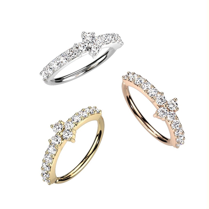 Twist ring with paving stones with a triangle center stone Piercings