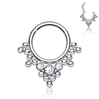 Hinged ring made of titanium with clustered beads and stones