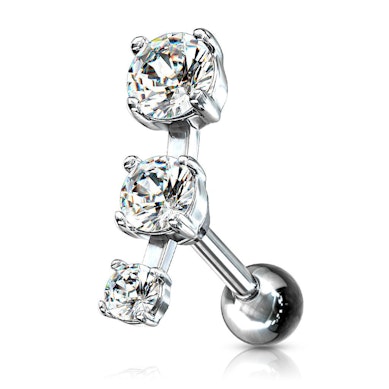 Ear piercing with three stones in a row
