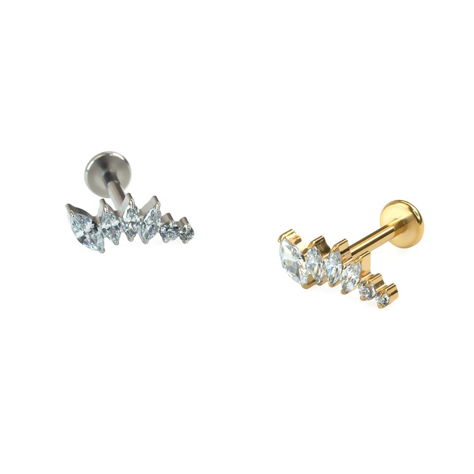 Curved titanium labret with stones in decreasing sizes