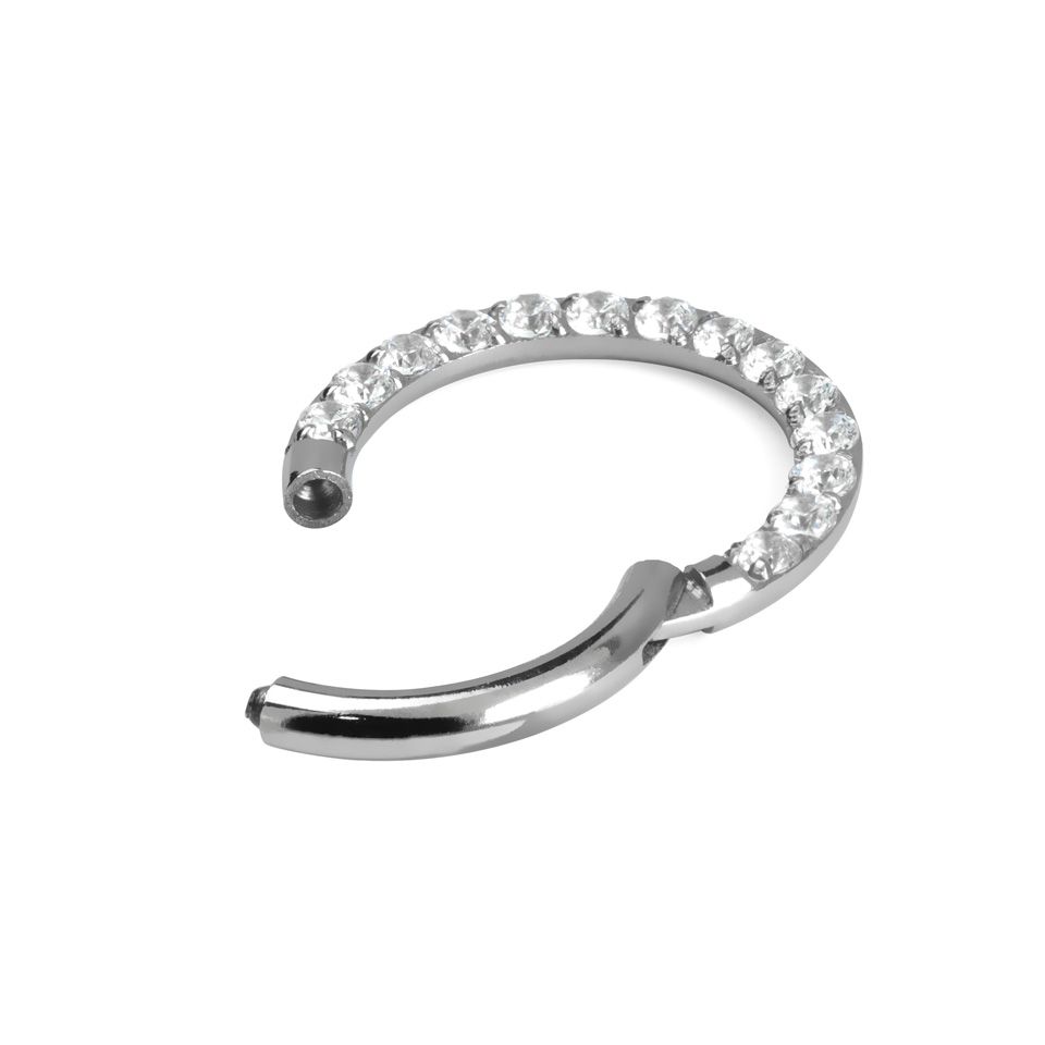 Hinged ring made of titanium with row of stones
