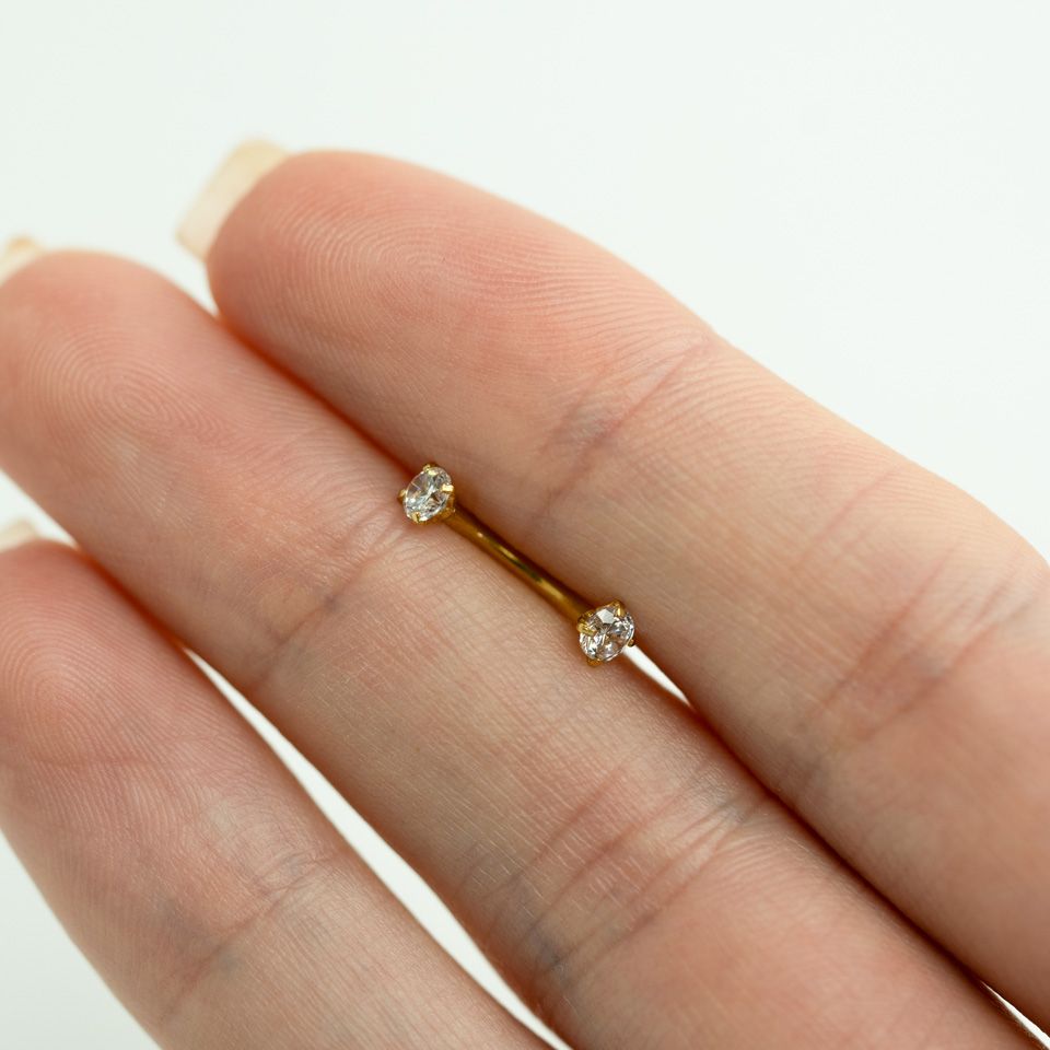 Curved barbell internally threaded with round gems