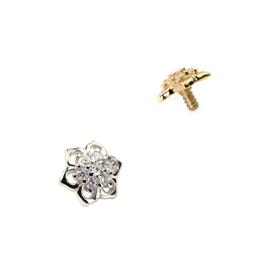 Dermal top made of 14k gold with seven zirconia gems at the centre