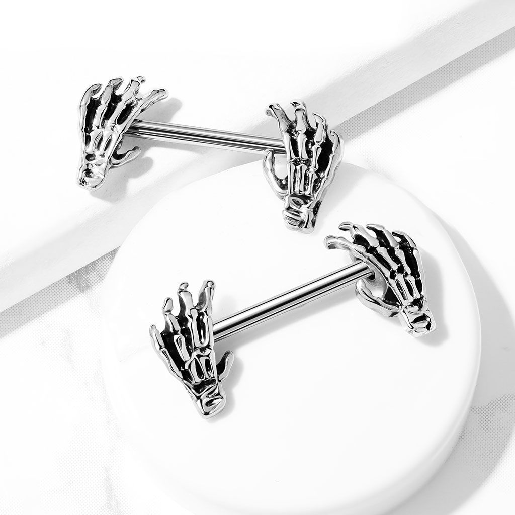 Nipple barbell with skeleton hands