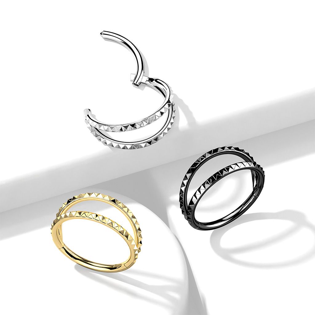 Hinged segment ring with a double hoop with pyramid cut design
