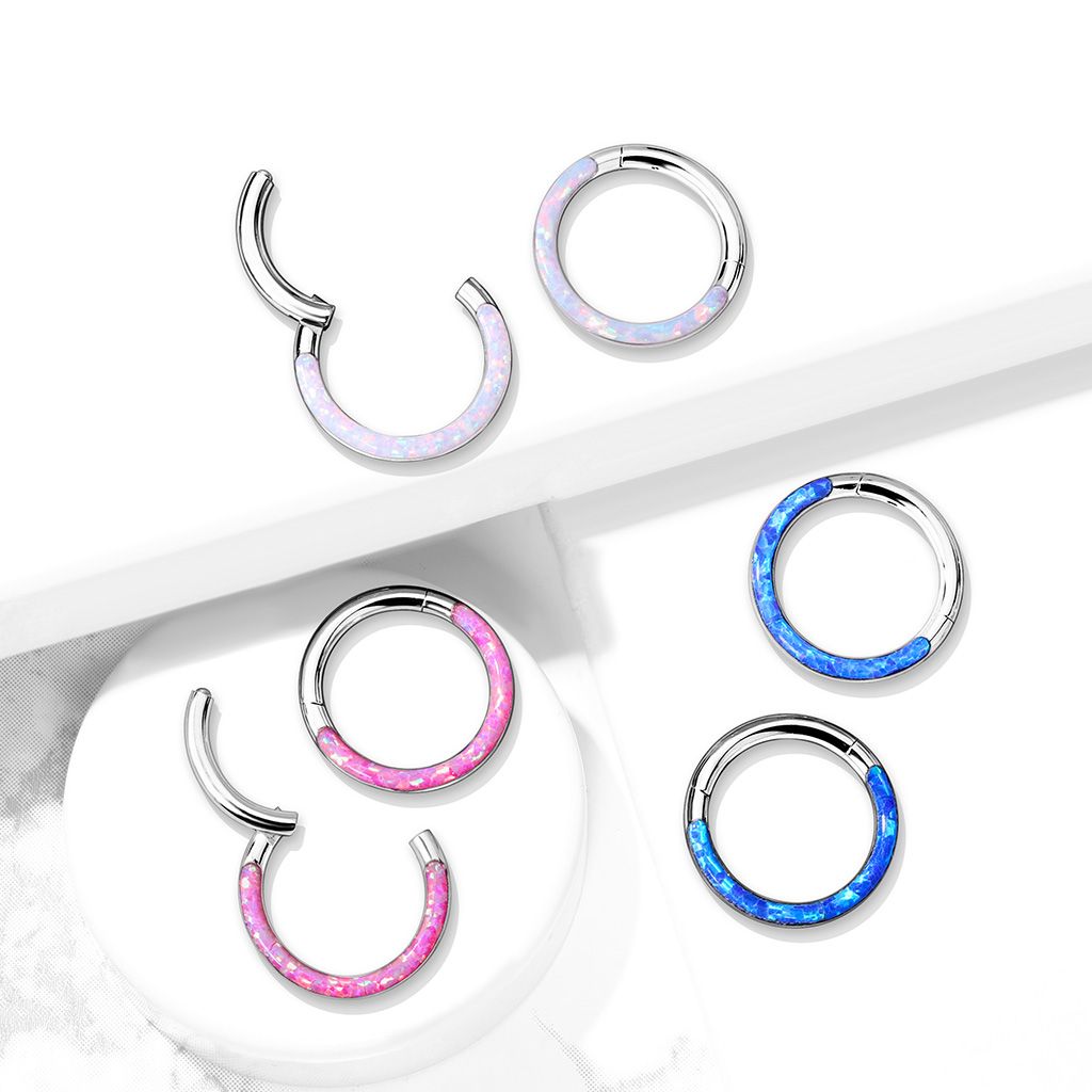 Ring made of titanium with a hinge and opal front