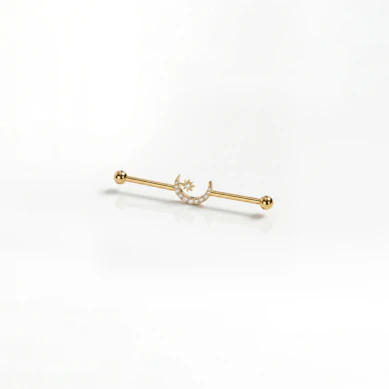 Industrial barbell in titanium with central moon and star