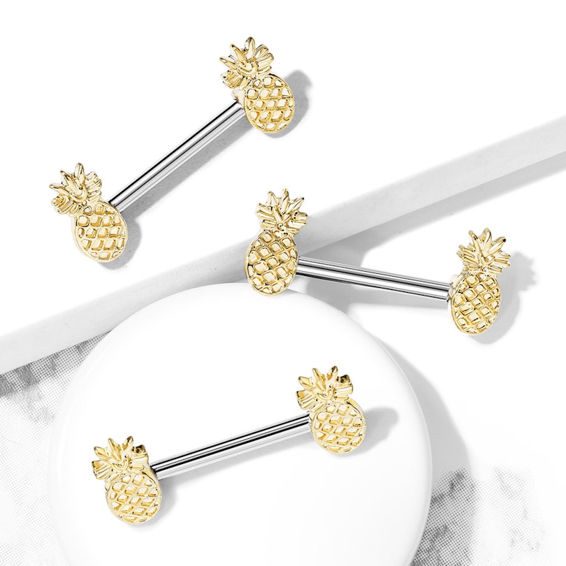 Nipple piercing with pineapples in the ends Piercing