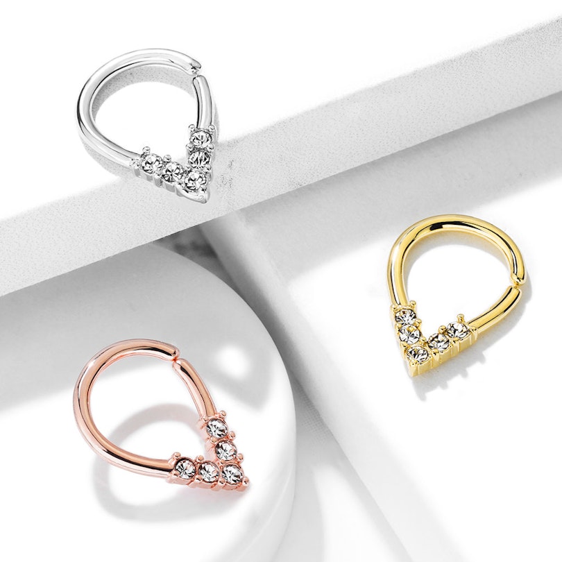 Seamless ring with top-down studded drop-shape Piercings