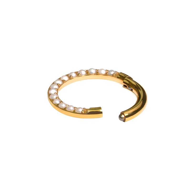 Titanium ring with forward facing pearls Piercings
