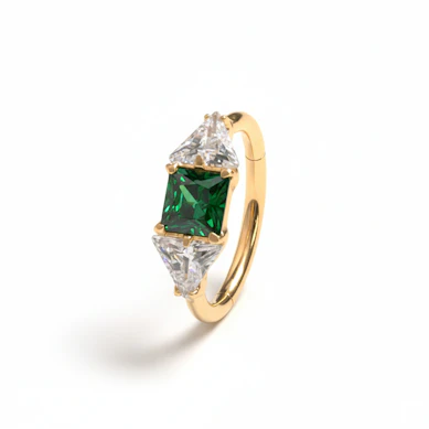 Titanium ring with central green stone
