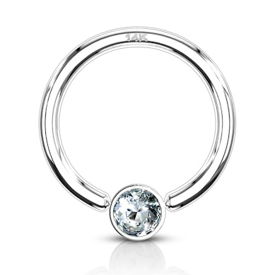 Captive bead ring made of 14k gold with bezel-set stone