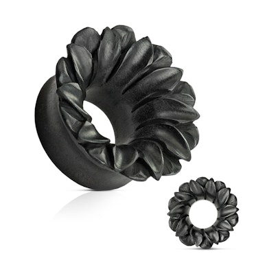 Tunnel in black organic wood as a flower