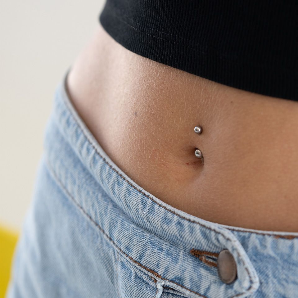 Best metal for new arrivals belly button piercing
