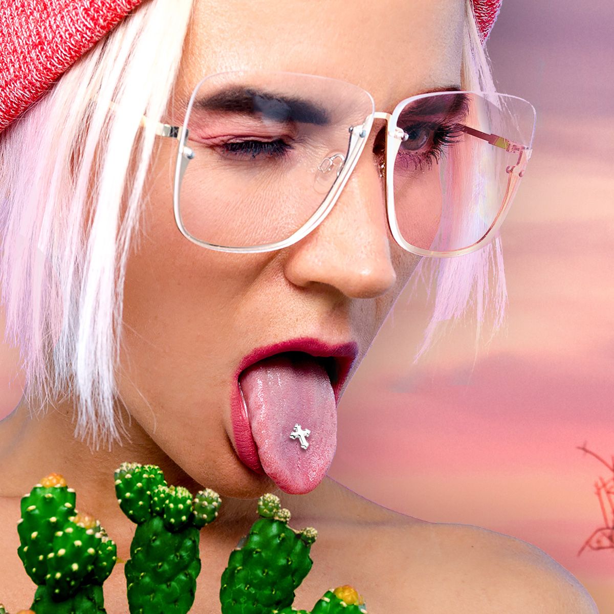 Cross tongue piercing top