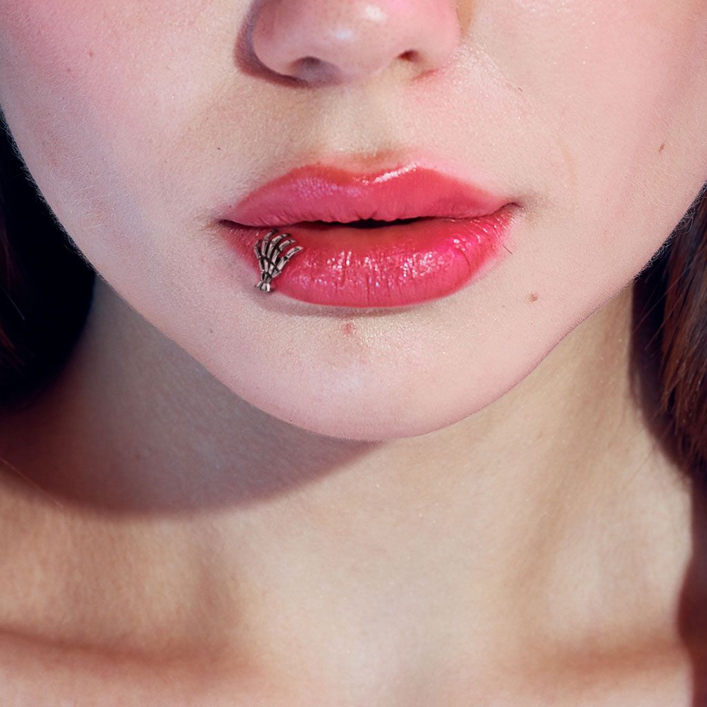 Skeleton hand on a labret Use it in the ear or lip piercing