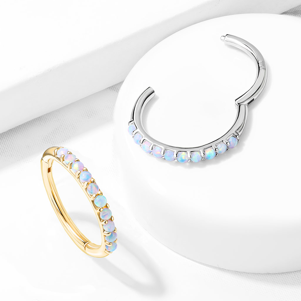 Clicker ring made of 14k gold with opalites