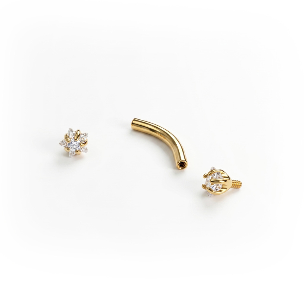 Curved barbell with star shaped CZ stones in titanium