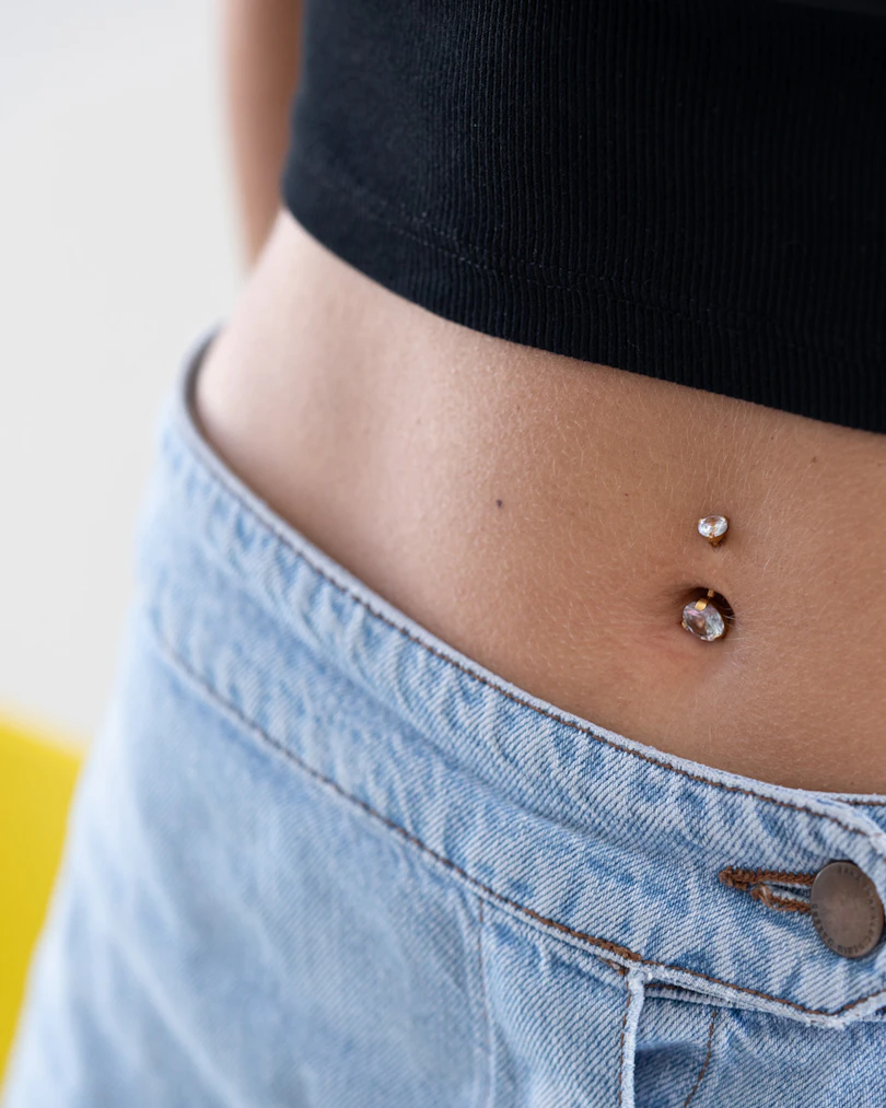 Belly button ring with large gems in top and bottom ball