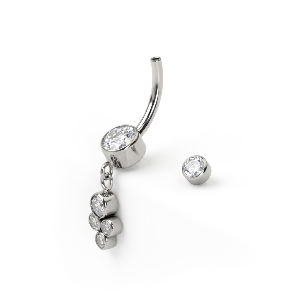 Belly button ring made of titanium with a dangling cluster of bezel-set stones