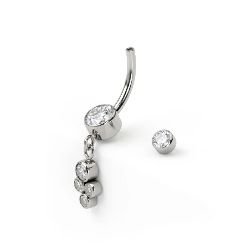 Belly button ring made of titanium with a dangling cluster of bezel-set stones
