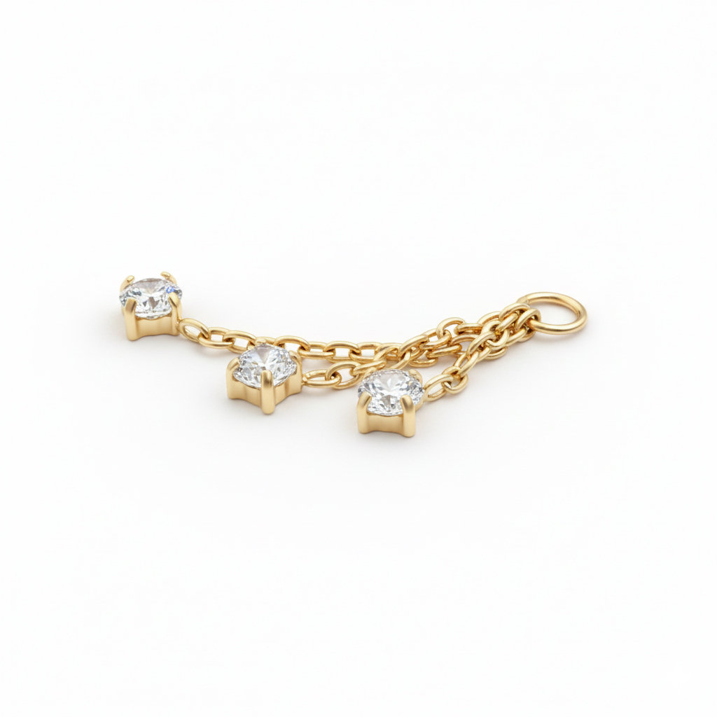 Charm with trio of stones