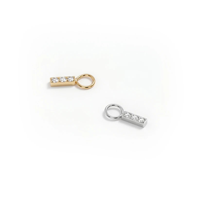 Simple titanium charm with three stones