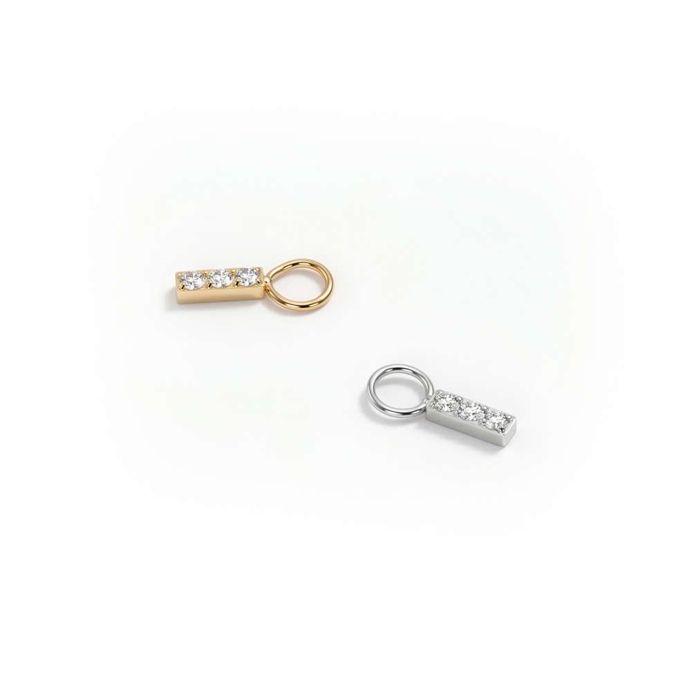 Simple titanium charm with three stones