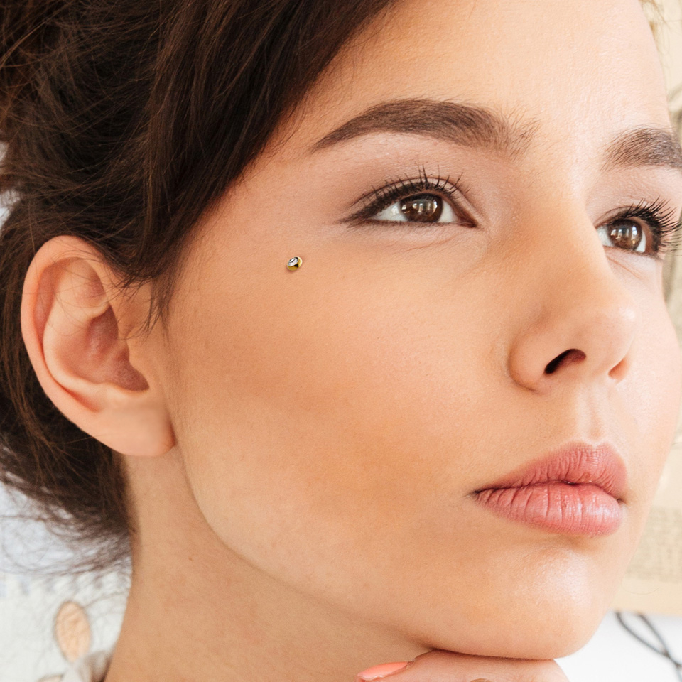 Dermal top jewelry in a variety of colors with crystal stone