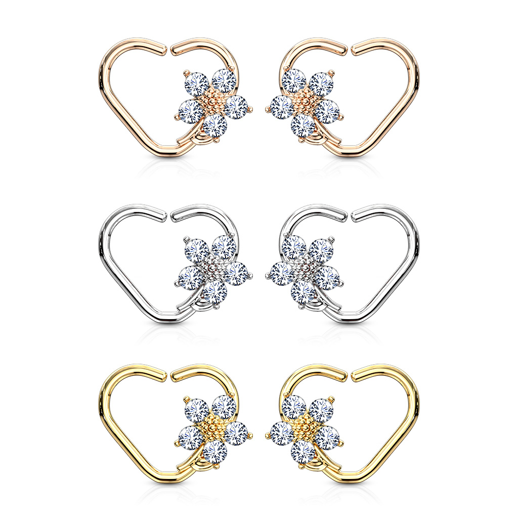 Ear piercing with heart shape and flower charm