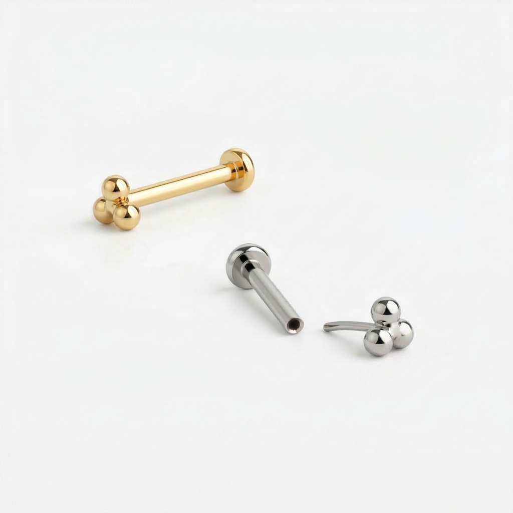 Titanium push-in labret with triangular ball cluster top