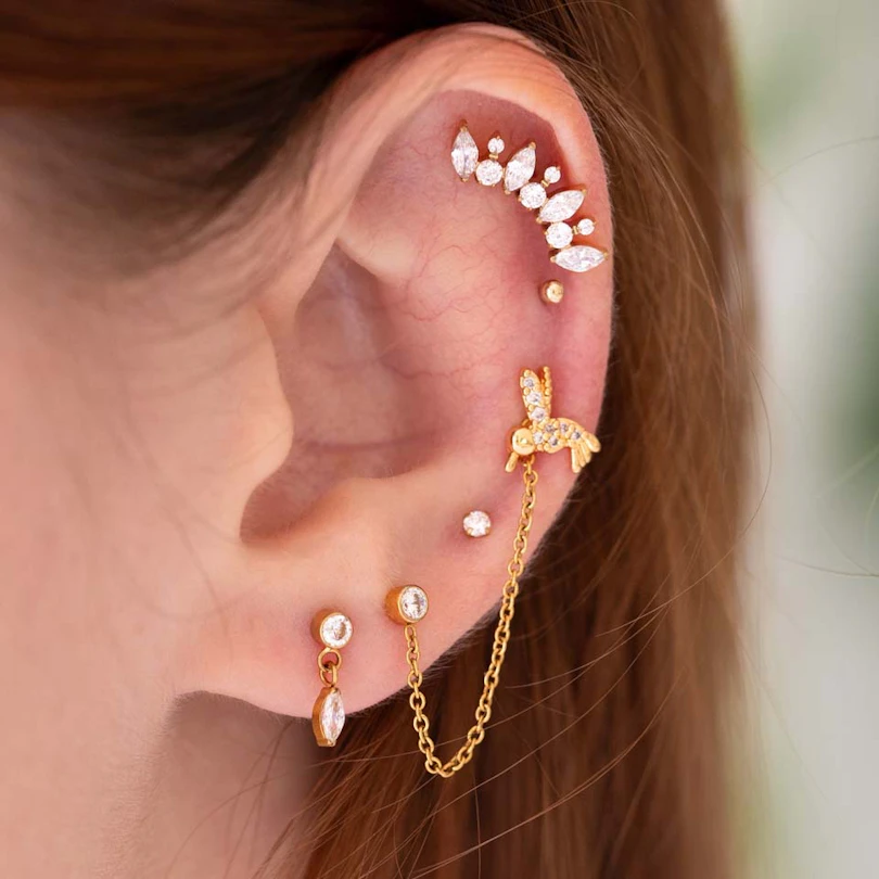 Labret s kamenčki in motivom kolibrija