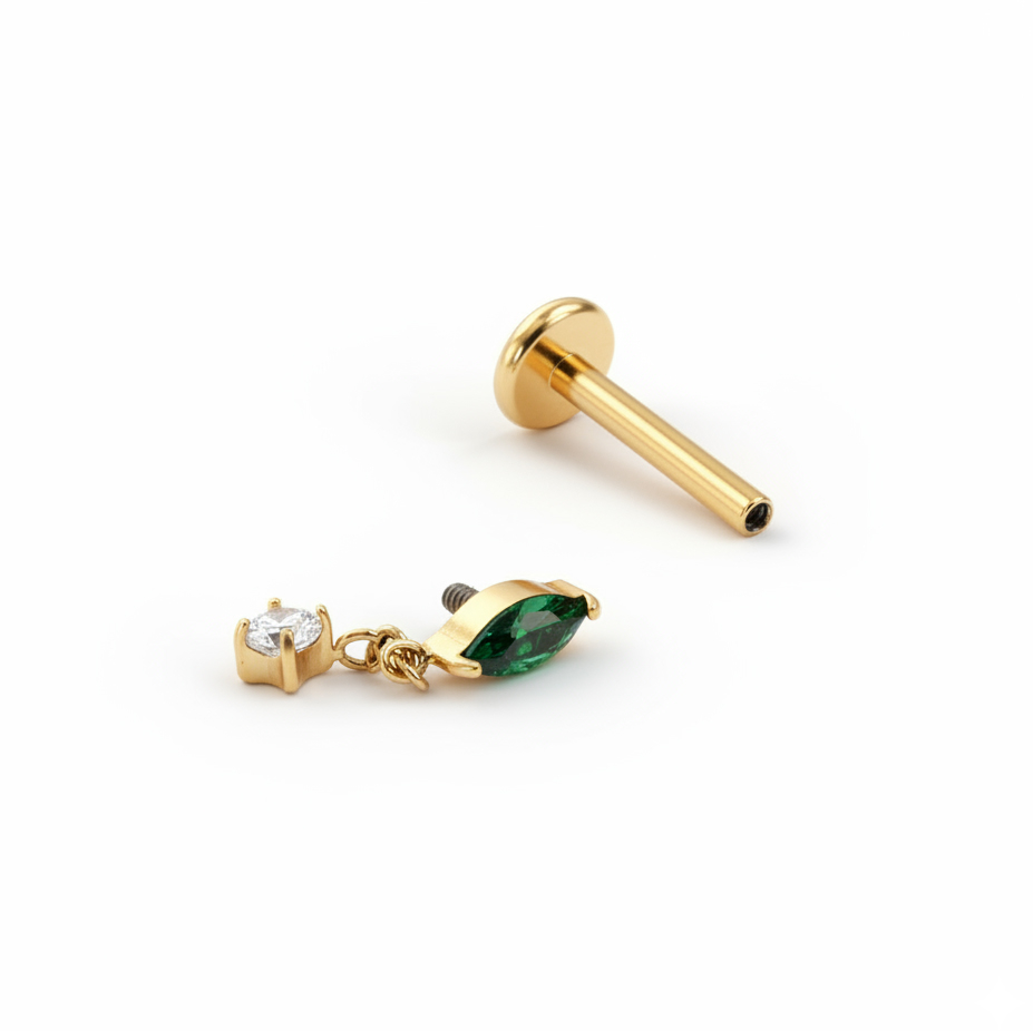 Titanium labret with emerald colored stone and dangle