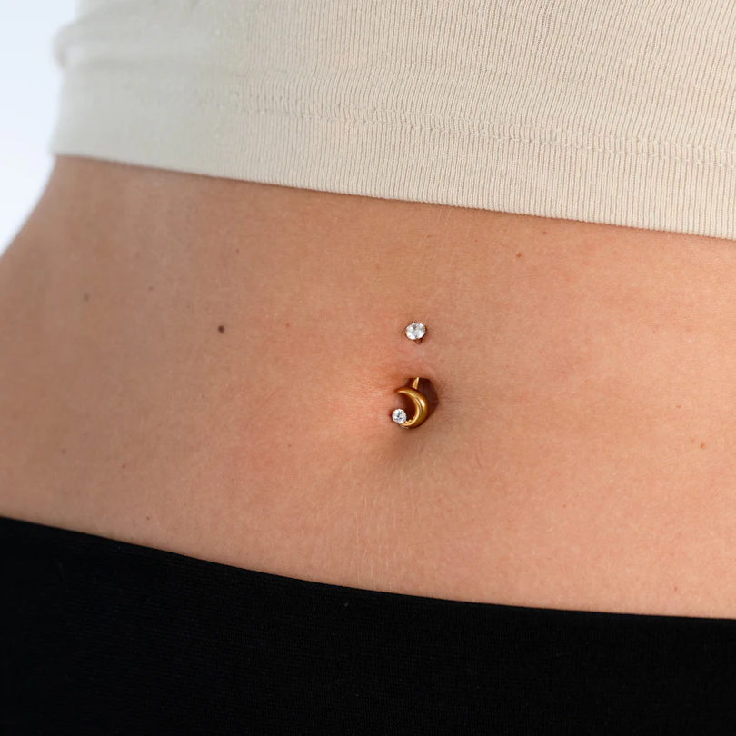 Titnaium belly ring with moon and star