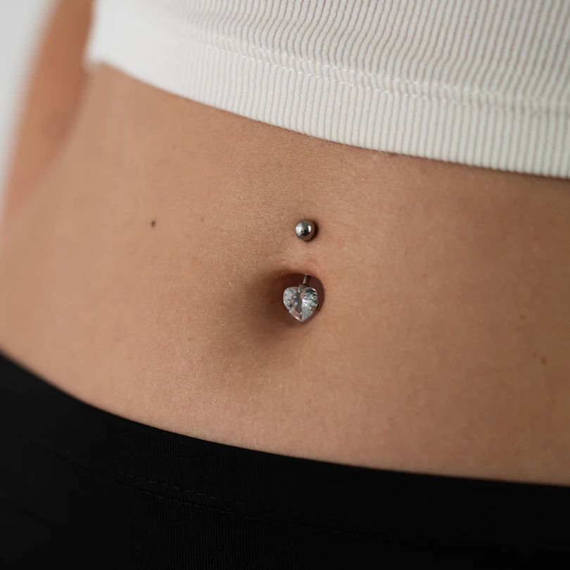 Titanium belly button ring with prong set heart stone