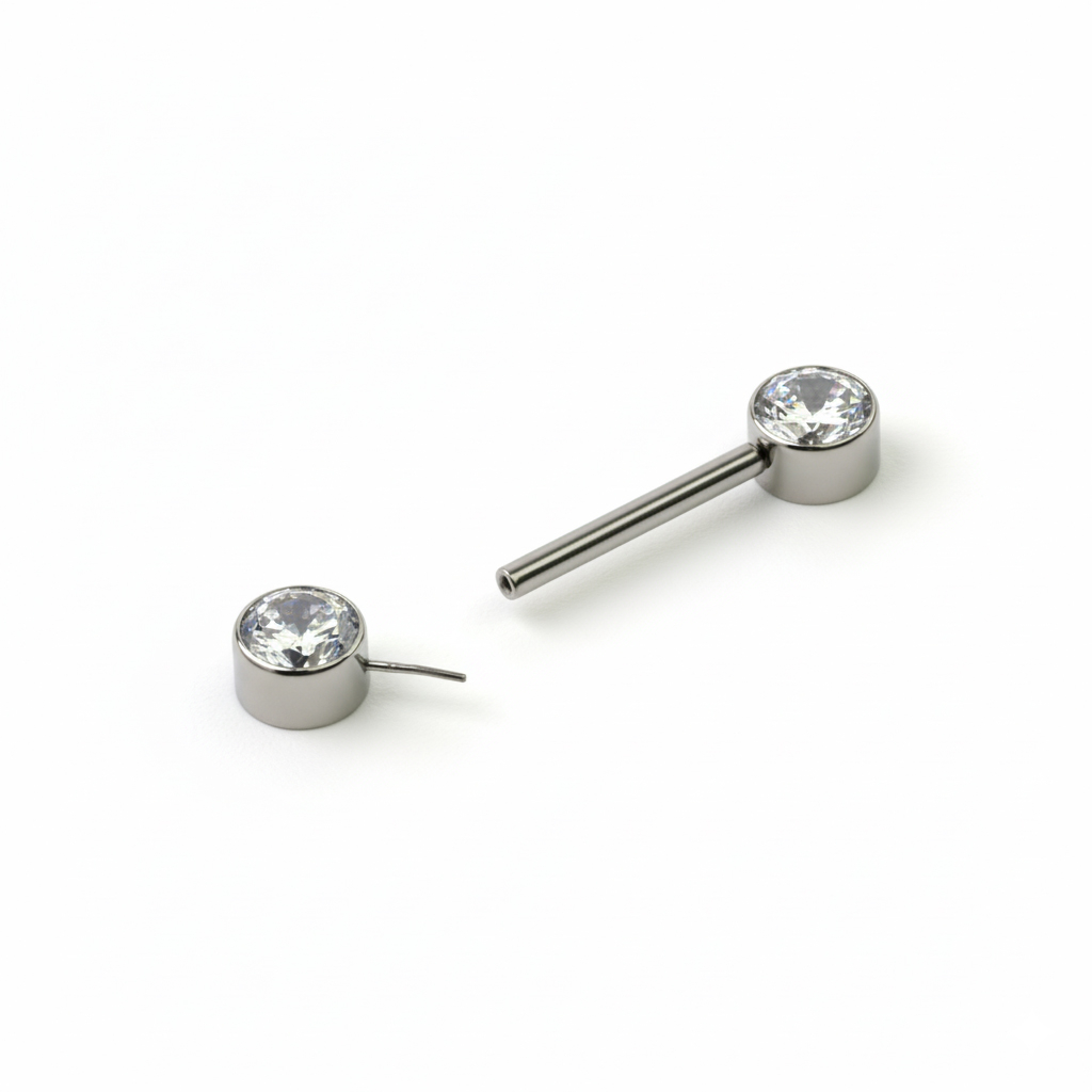 Nipple barbell made of titanium with threadless push-in bezel set stones