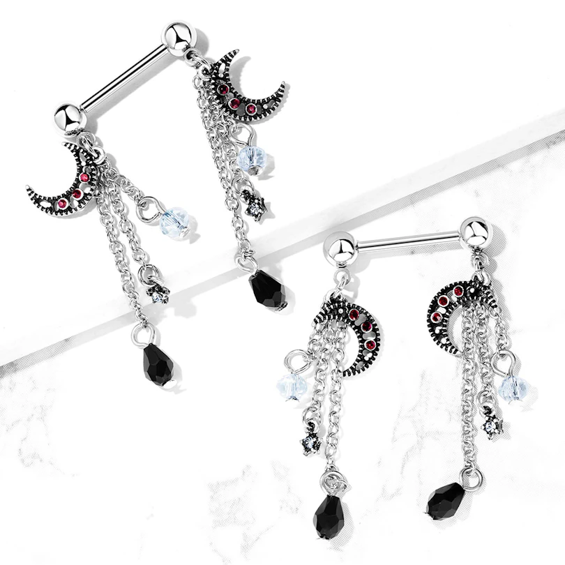 Nipple piercing with stars and moons on pendants