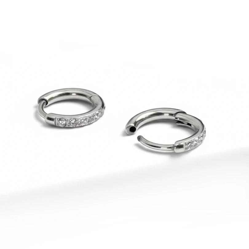 Pair of titanium huggie rings with gemstones