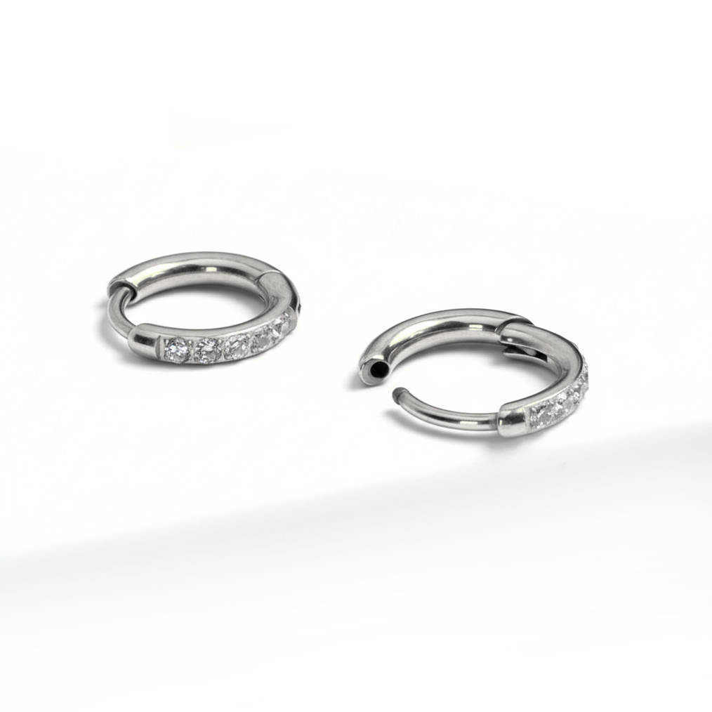 Pair of titanium huggie rings with gemstones
