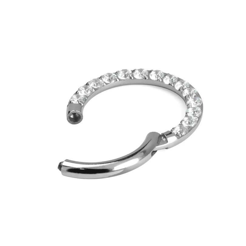 Hinged ring made of titanium with row of stones