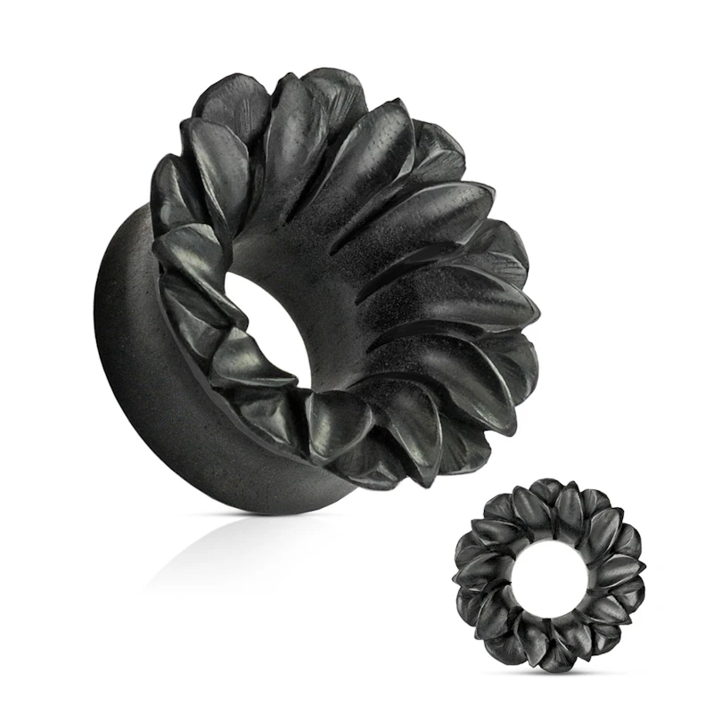 Tunnel in black organic wood as a flower